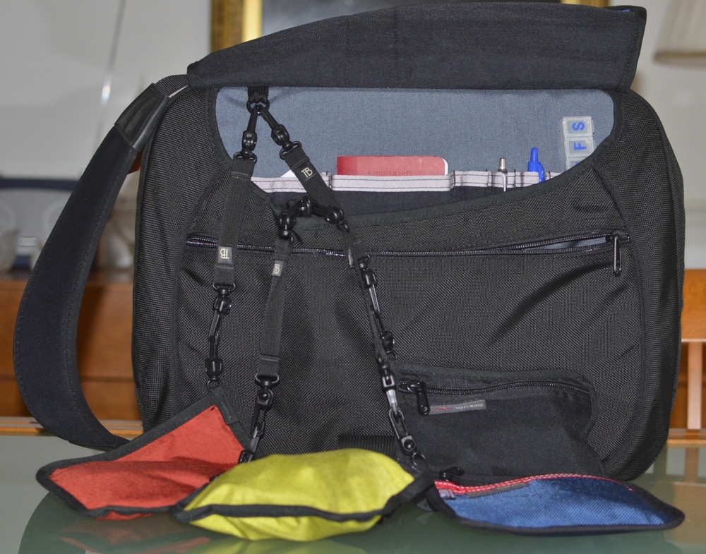 Under the front flap is an effective organiser for notebooks, pens and small items while Tom Bihn